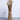 A beige vase with pampas grass by Woodland Pulse. This is a modernist vase from their boho vases collection.