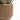 A beige planter pot. This is one of Woodland Pulse's wooden indoor plant pots.