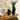 Black vase decor with flowers.