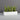 Short white low rectangular planter.