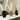 Set of small vases with pampas grass in black, beige, and brown.